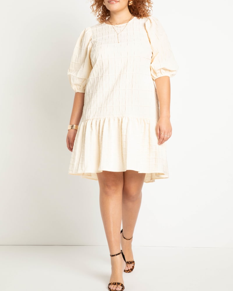 Front of a model wearing a size 20 Textured Open Back Dress in Buttercream by ELOQUII. | dia_product_style_image_id:275252